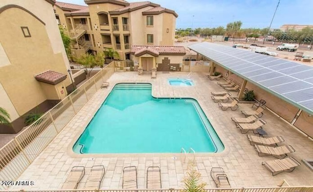 view of swimming pool with a patio area