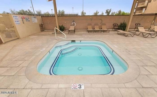 view of pool featuring a patio area