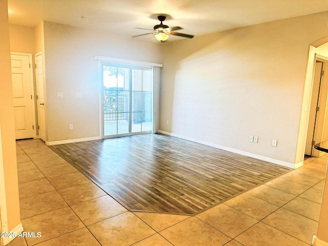 unfurnished room featuring ceiling fan and light tile patterned floors