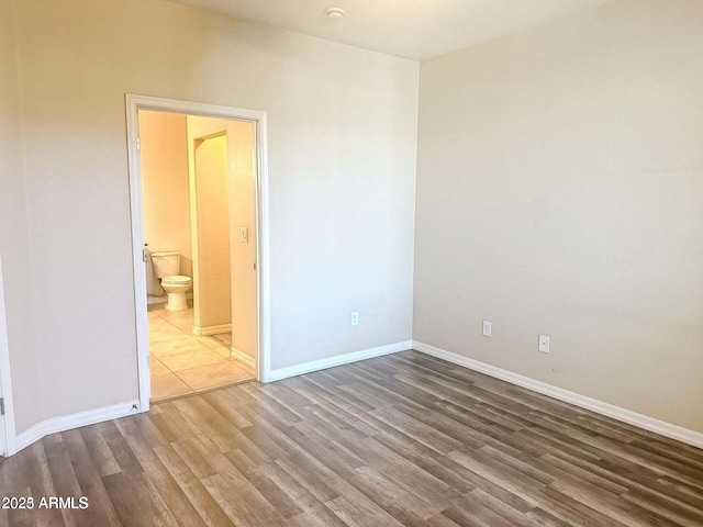 empty room featuring hardwood / wood-style floors