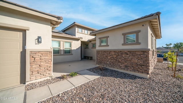 view of property exterior featuring a garage