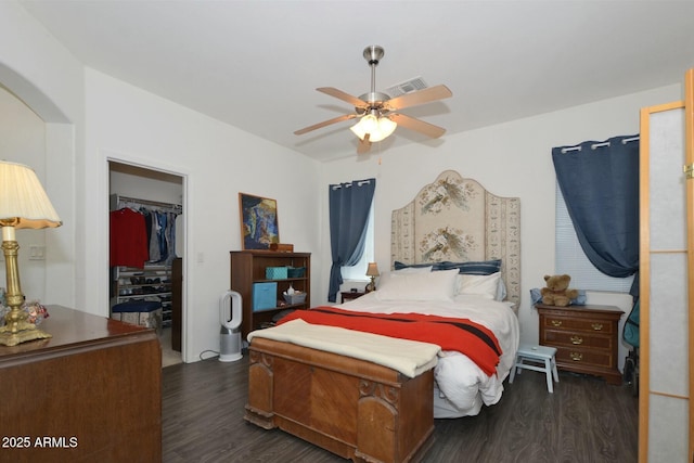 7604 E Sedalia Trl, Prescott Valley, AZ 86315 - bedroom featuring a closet, dark hardwood / wood-style floors, ceiling fan, and a spacious closet