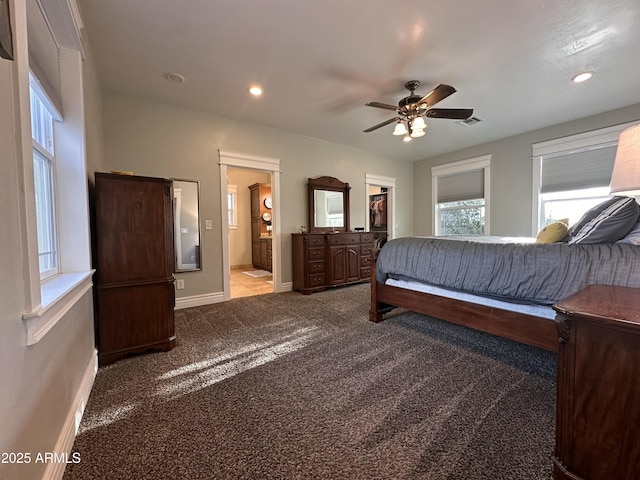 carpeted bedroom featuring recessed lighting, a spacious closet, baseboards, connected bathroom, and visible vents