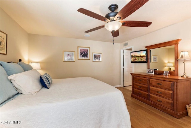 bedroom featuring light hardwood / wood-style flooring and ceiling fan