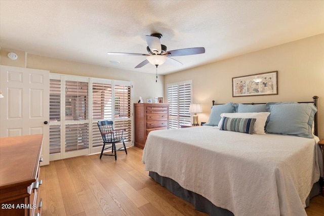 bedroom with ceiling fan and light wood-type flooring