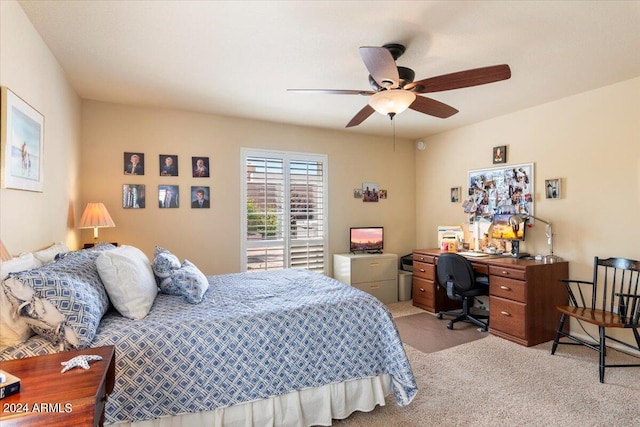 bedroom featuring light carpet and ceiling fan