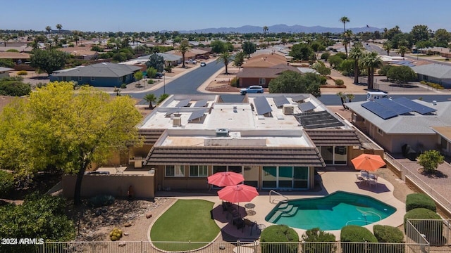 birds eye view of property with a mountain view