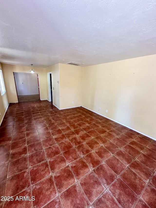 3211 W Campbell Ave, Phoenix, AZ 85017 - unfurnished room featuring baseboards and dark tile patterned floors