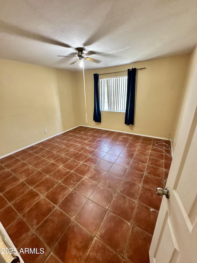3211 W Campbell Ave, Phoenix, AZ 85017 - spare room featuring a ceiling fan and dark tile patterned floors