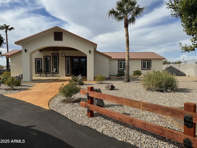 920 N 104th St, Mesa, AZ 85207 - back of property with stucco siding, metal roof, and french doors