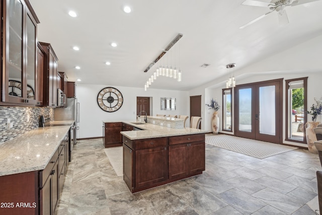 920 N 104th St, Mesa, AZ 85207 - kitchen featuring a sink, appliances with stainless steel finishes, decorative backsplash, glass insert cabinets, and recessed lighting
