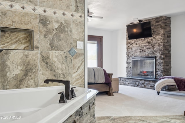 920 N 104th St, Mesa, AZ 85207 - full bath featuring a fireplace, a garden tub, a ceiling fan, and ensuite bath