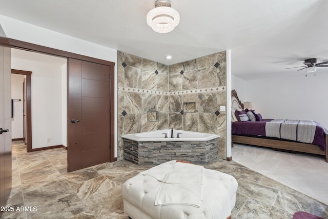 920 N 104th St, Mesa, AZ 85207 - full bath featuring a garden tub, connected bathroom, a ceiling fan, and baseboards