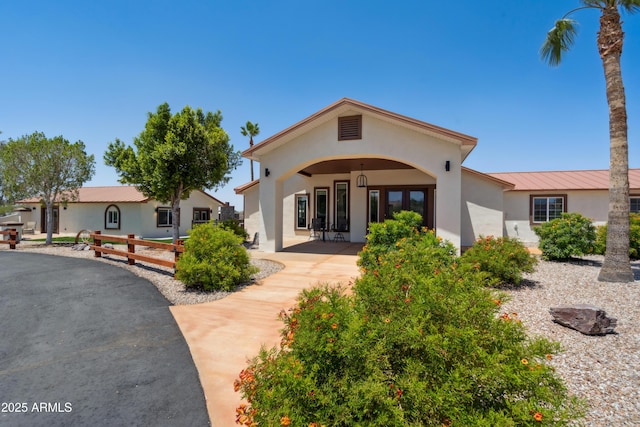 920 N 104th St, Mesa, AZ 85207 - rear view of house with stucco siding, metal roof, and a standing seam roof