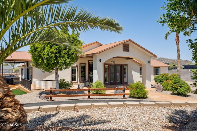920 N 104th St, Mesa, AZ 85207 - rear view of property with french doors, stucco siding, covered porch, and metal roof