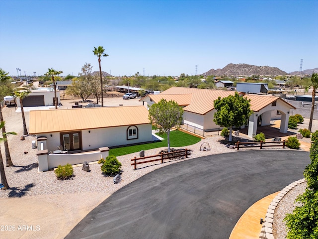 920 N 104th St, Mesa, AZ 85207 - view of front of home with stucco siding, metal roof, a mountain view, and french doors