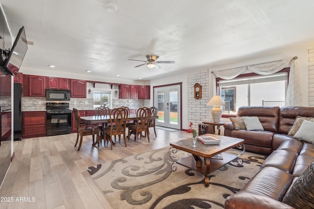 920 N 104th St, Mesa, AZ 85207 - living room featuring light wood finished floors and ceiling fan