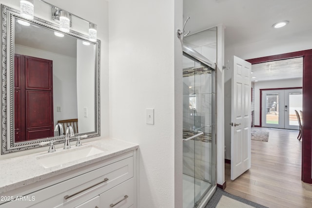920 N 104th St, Mesa, AZ 85207 - full bath featuring french doors, vanity, a stall shower, and wood finished floors