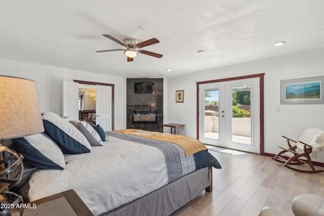 920 N 104th St, Mesa, AZ 85207 - bedroom with french doors, access to outside, light wood finished floors, baseboards, and a ceiling fan