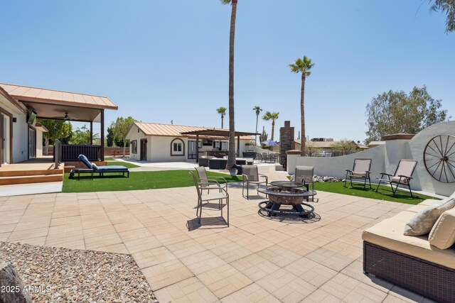 920 N 104th St, Mesa, AZ 85207 - view of patio with an outdoor living space with a fire pit