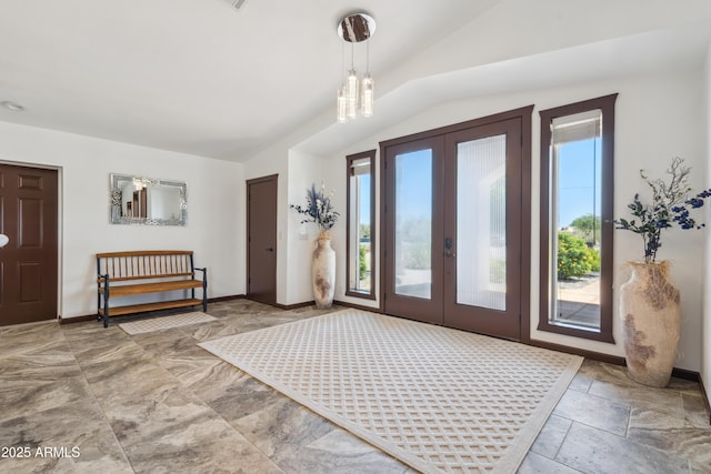 920 N 104th St, Mesa, AZ 85207 - foyer entrance with healthy amount of natural light, lofted ceiling, french doors, and baseboards