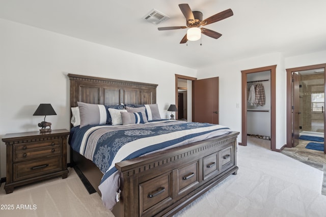 920 N 104th St, Mesa, AZ 85207 - bedroom with light colored carpet, connected bathroom, and ceiling fan
