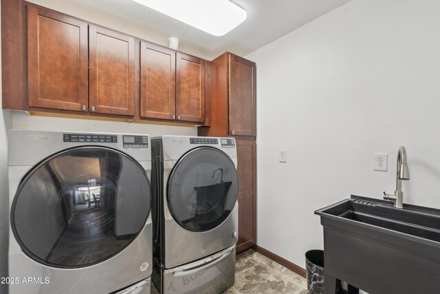 920 N 104th St, Mesa, AZ 85207 - laundry area featuring cabinet space, washer and clothes dryer, and baseboards