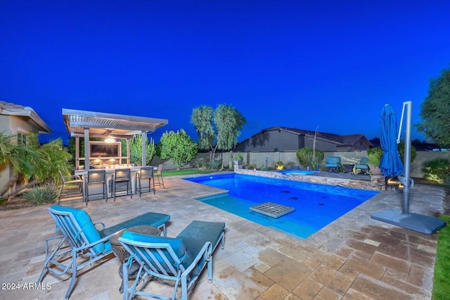 view of swimming pool with a pergola, a patio area, and a bar