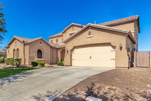 21605 S 187th Way, Queen Creek, AZ 85142 - mediterranean / spanish-style home with a tile roof, stucco siding, a garage, driveway, and a gate