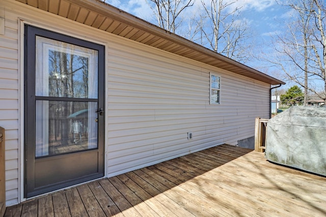 wooden deck featuring area for grilling