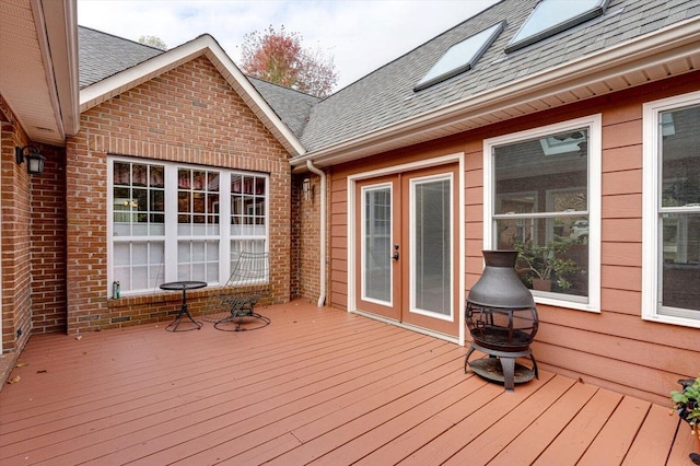 deck featuring an outdoor fire pit