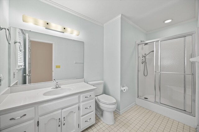 bathroom featuring toilet, a shower stall, crown molding, and vanity