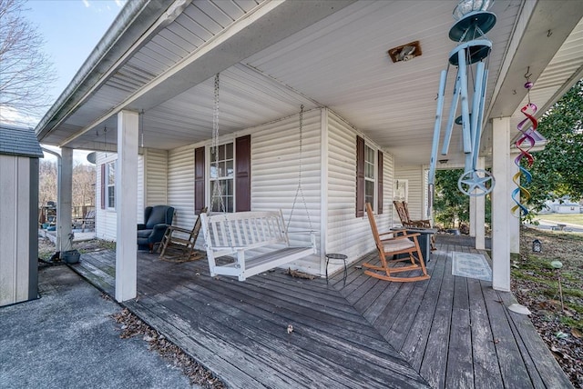 wooden deck featuring a porch