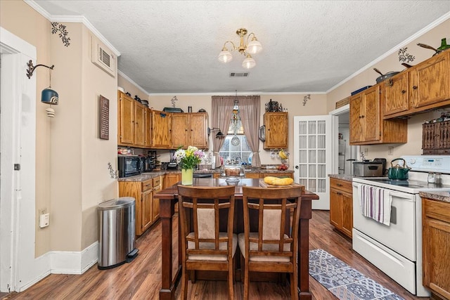 kitchen with brown cabinetry, dark wood-style flooring, visible vents, and white electric range oven