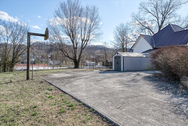 view of street with concrete driveway