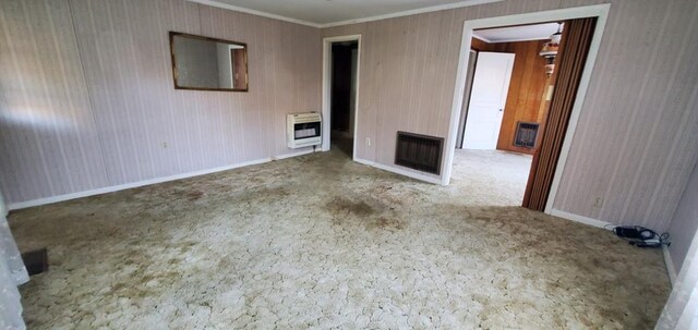 empty room featuring carpet, a fireplace, and heating unit