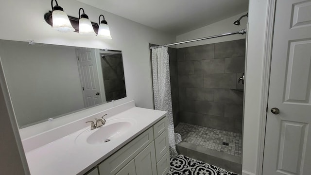 full bathroom with a stall shower, vanity, and toilet