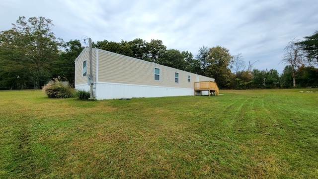 view of property exterior with a yard