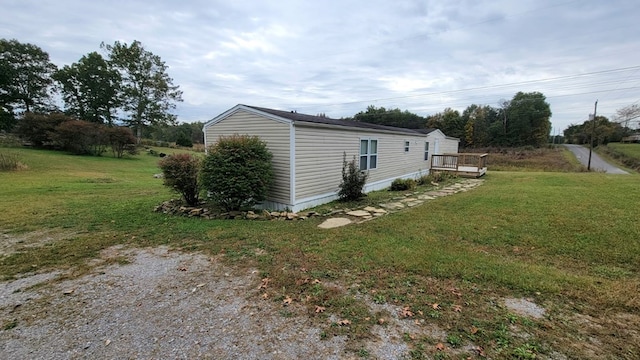 view of side of property featuring a yard