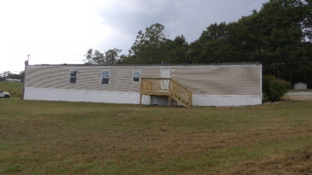 rear view of house with a lawn