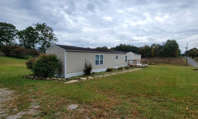 view of side of property with a yard