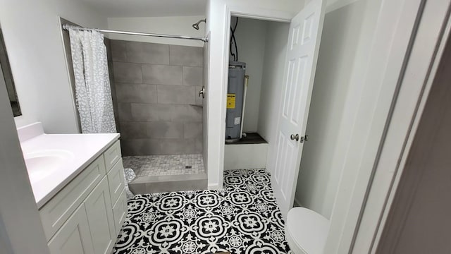 full bath featuring toilet, tile patterned floors, vanity, a shower stall, and water heater