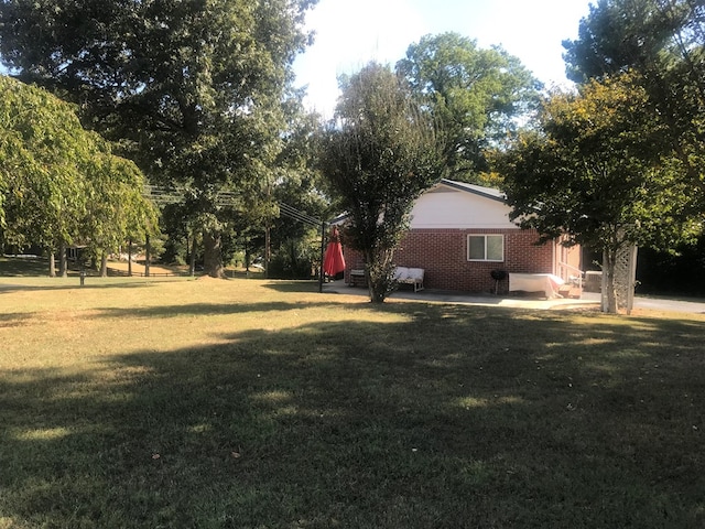 view of yard with a patio area