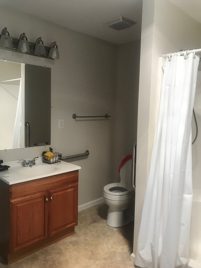 bathroom featuring baseboards, visible vents, vanity, and a shower with shower curtain