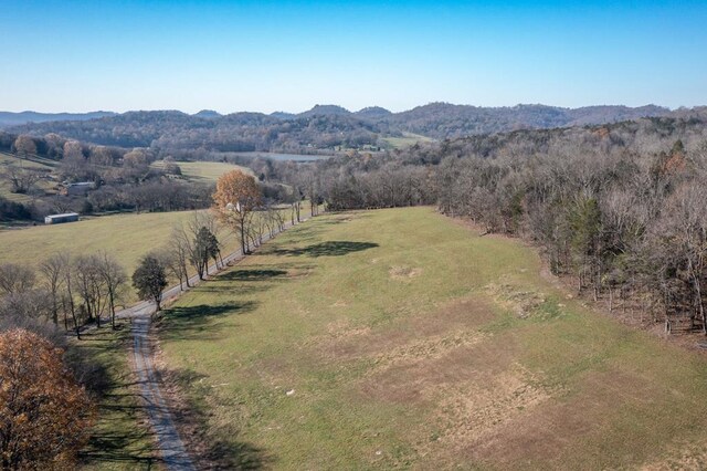 drone / aerial view featuring a rural view and a mountain view