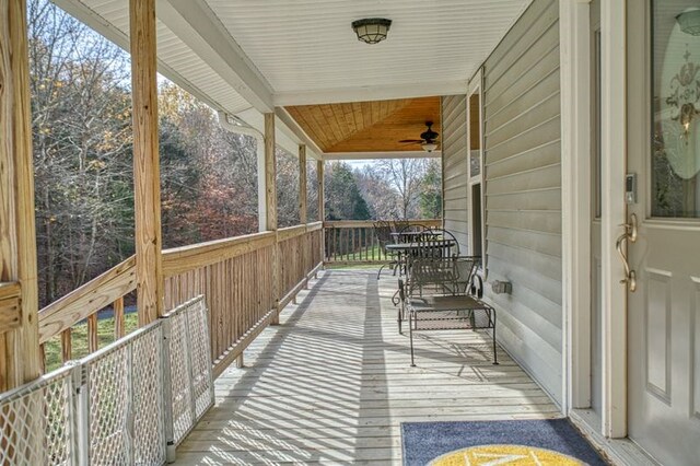 wooden terrace featuring ceiling fan