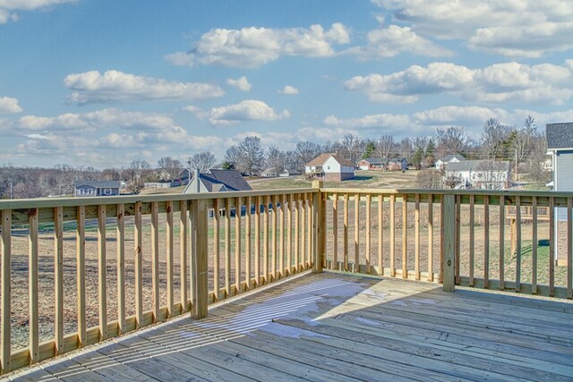 wooden terrace featuring a residential view