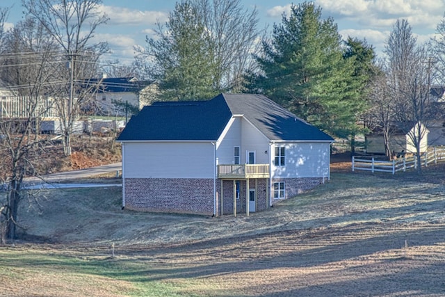 view of outbuilding featuring fence