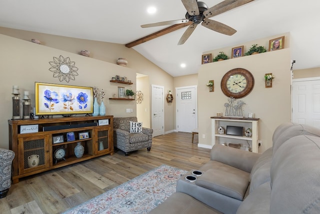 living area with vaulted ceiling with beams, baseboards, light wood-style flooring, and a ceiling fan