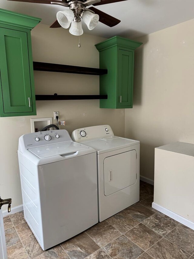 laundry room with washer and clothes dryer, cabinet space, stone finish flooring, ceiling fan, and baseboards